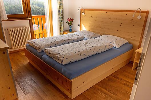 Sypialnia w apartamencie wakacyjnym Fanes.